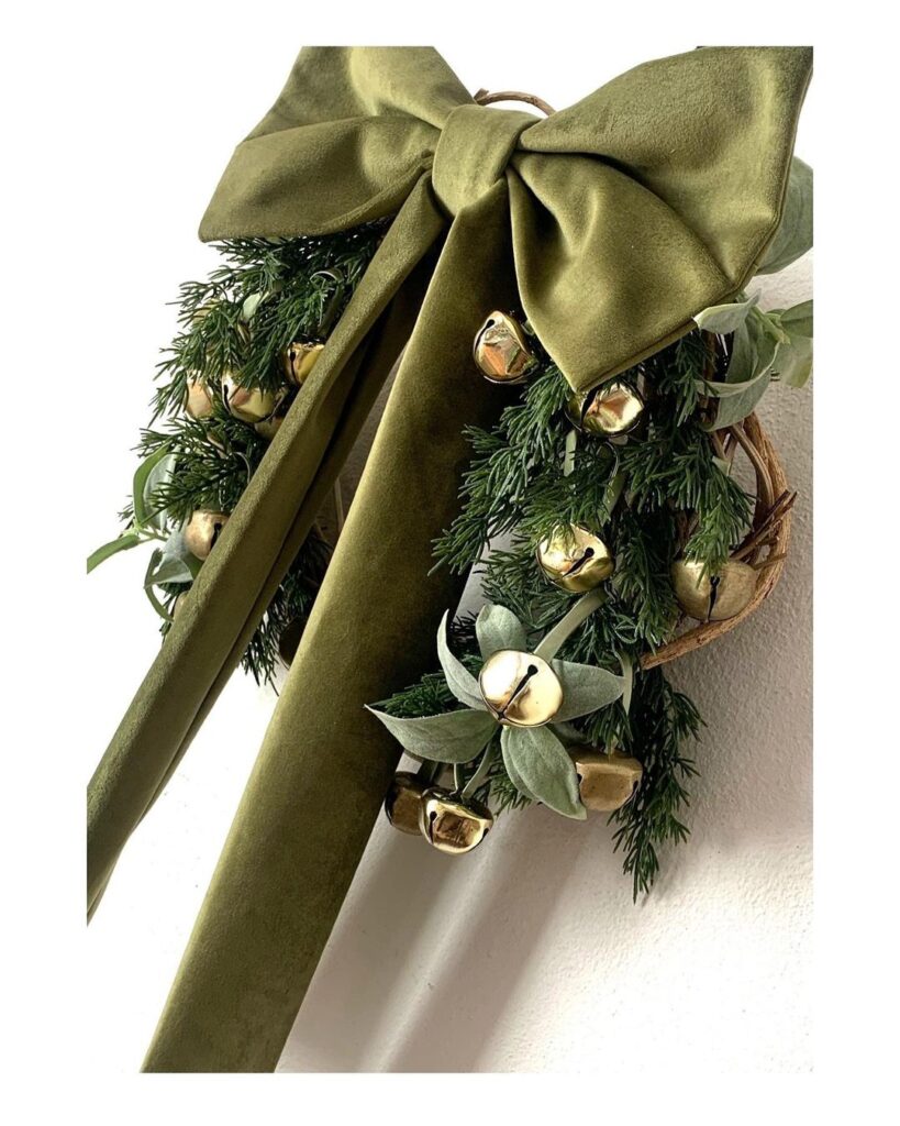 Christmas bell wreath with connected ribbon bow